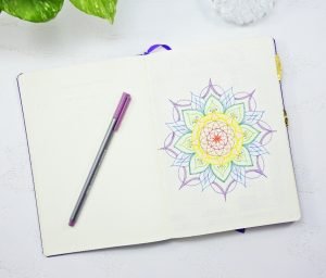 a colorful mandala on the first page of a bullet journal