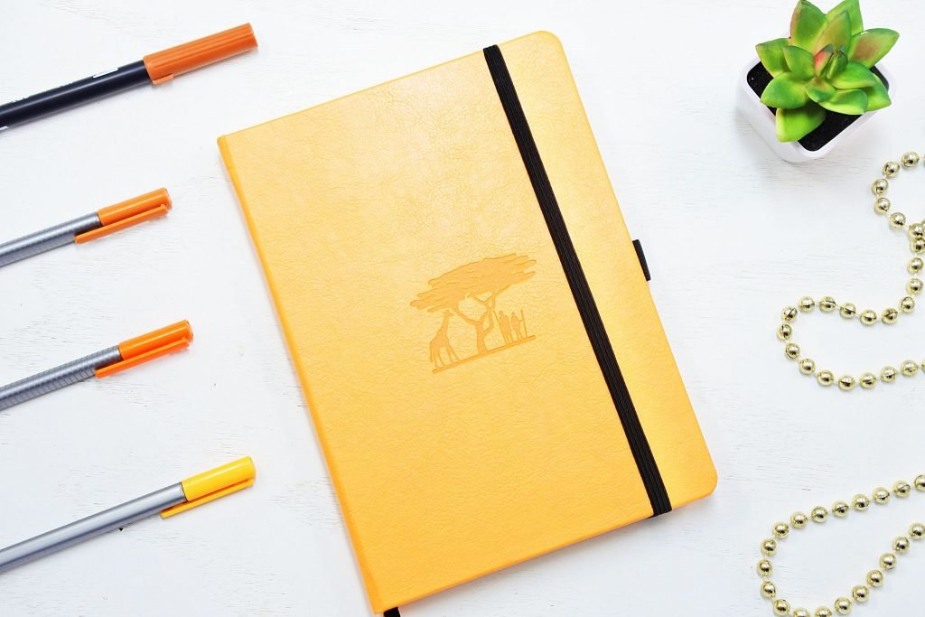 dingbats earth collection dot grid notebook in yellow