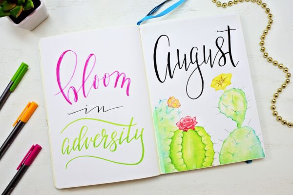 August bullet journal cover page and quote.